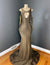A bronze and black glittery casino gown with a keyhole front and shoulder cutouts, featuring a mermaid train by Bellz Couture in Detroit.