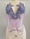 light purple applique beaded and chain shoulder piece on a mannequin with 'Collapsible Shoulder' label. Bellz Couture Detroit 