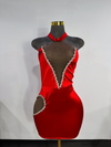 red halter dress with heart side cutout trimmed in silver rhinestones by Bellz Couture Detroit on mannequin against plan wall